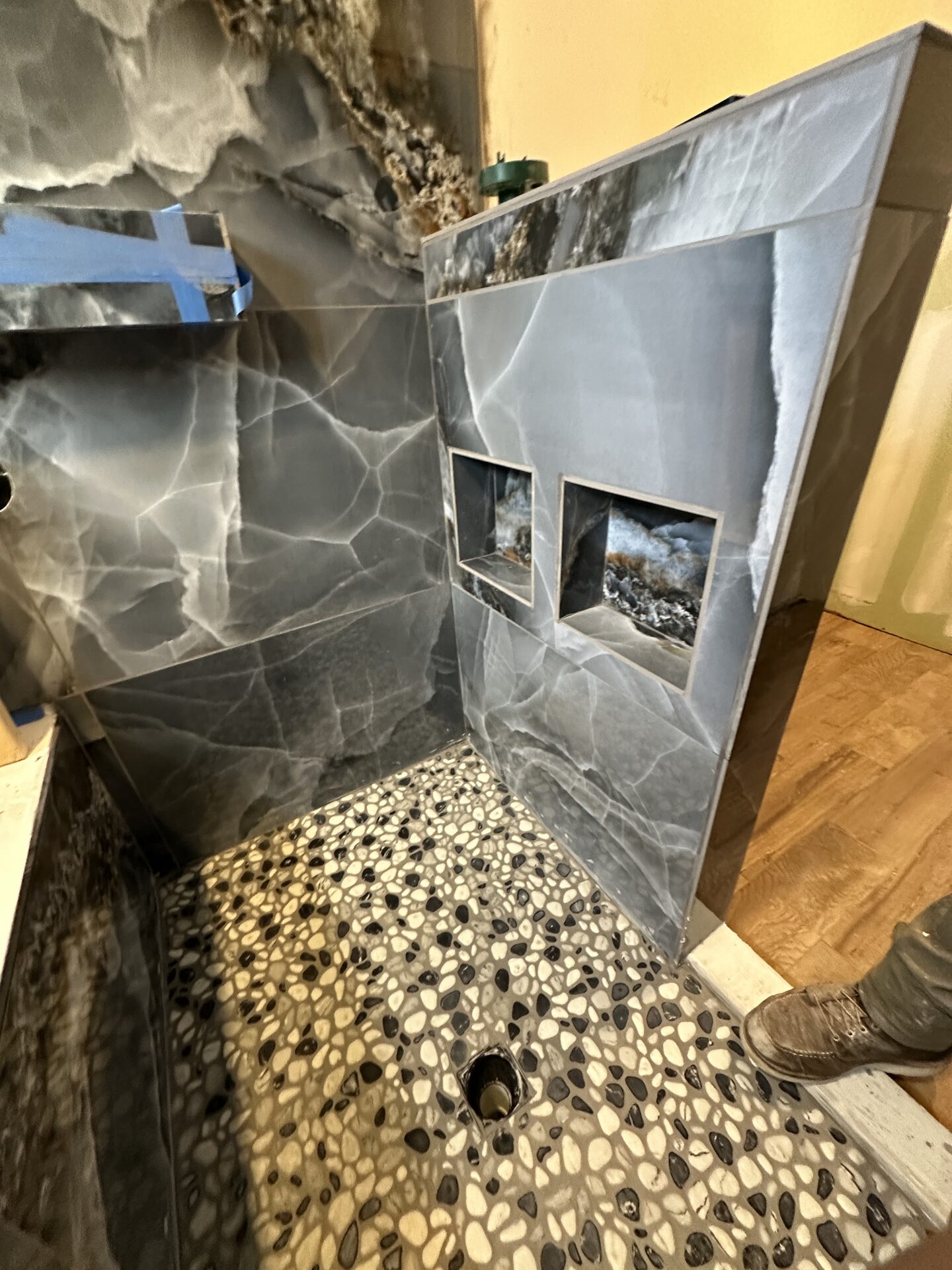 Custom onyx-look tile shower niches in progress